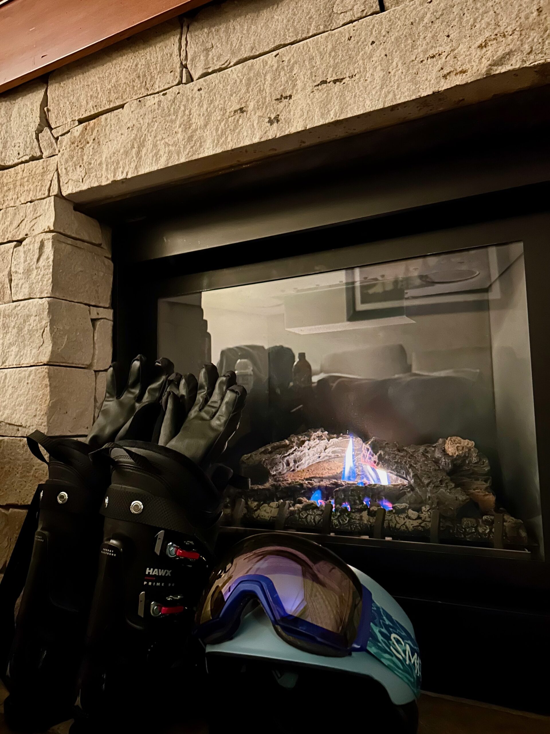 Drying our ski gears next to the fireplace