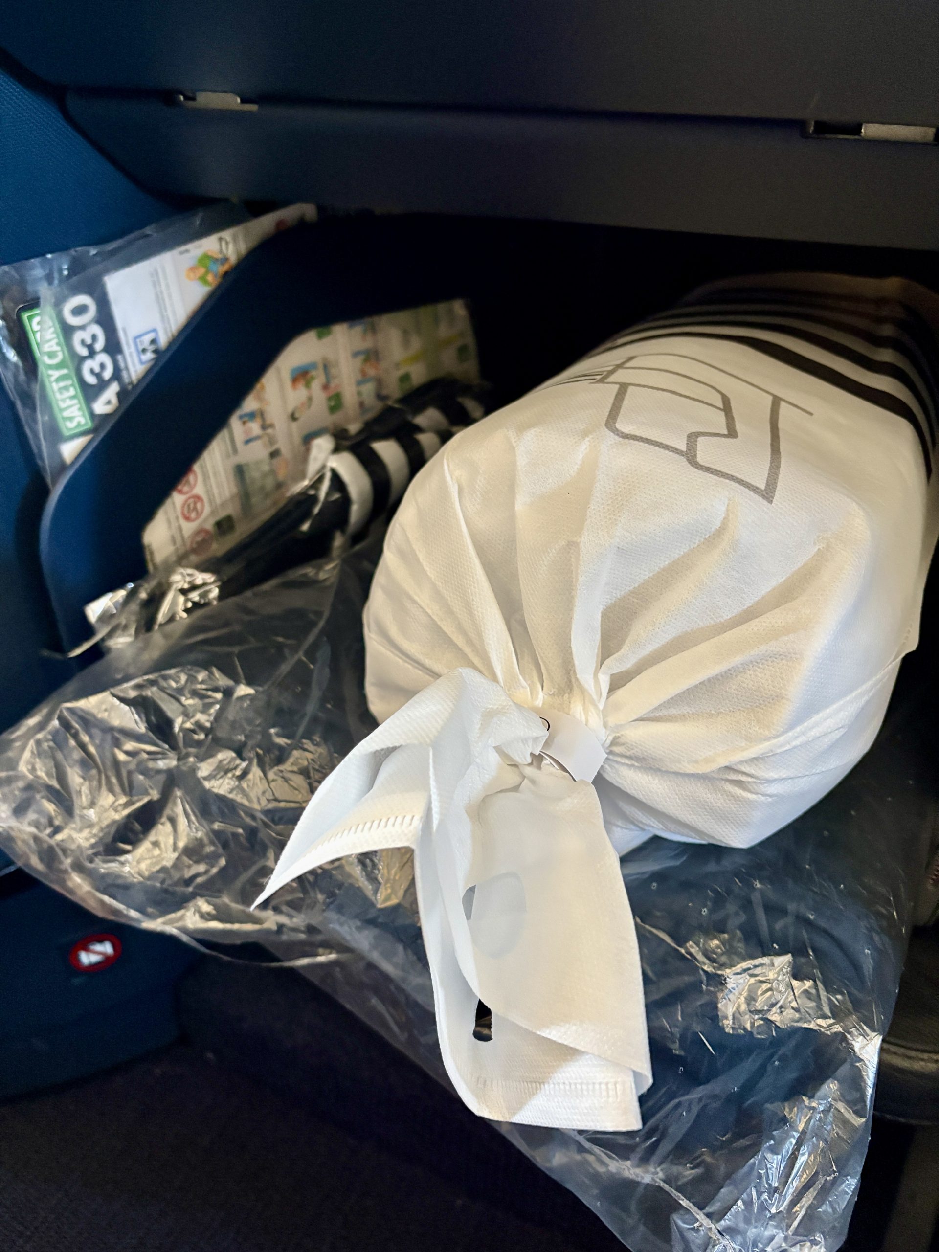 Slippers, blanket, and rolled up mattress