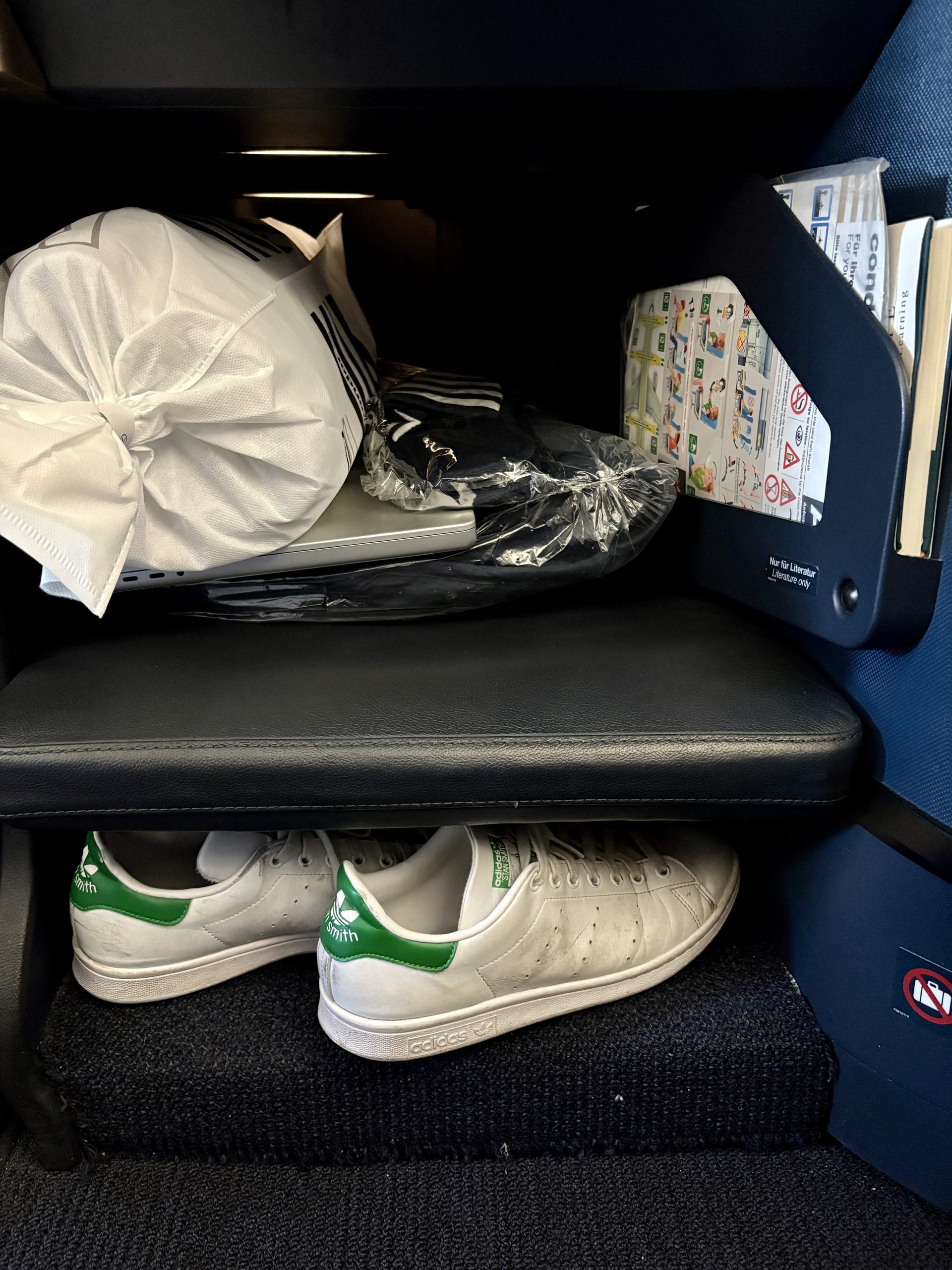 Storage below TV and shallow shoe storage