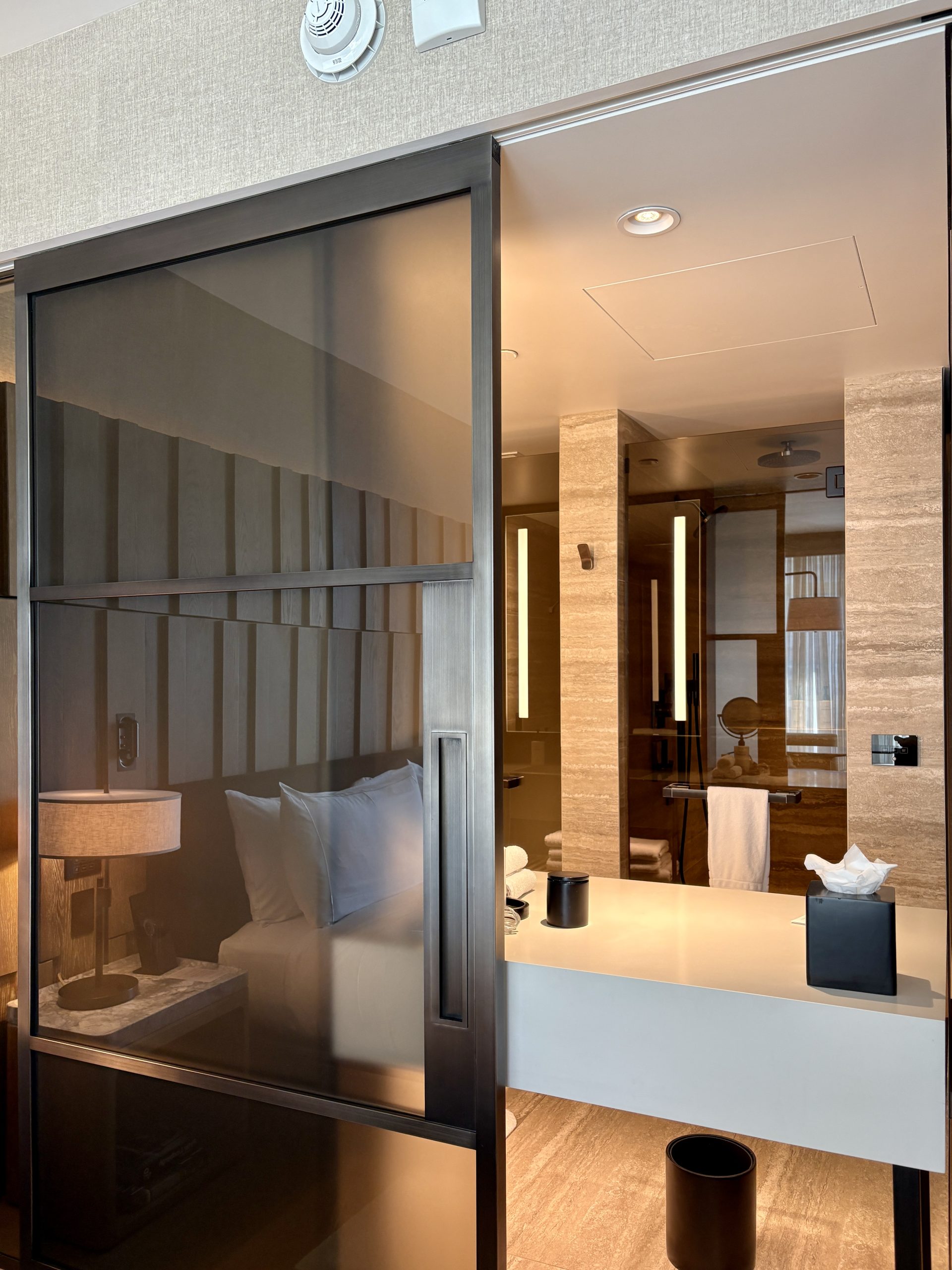 Sliding door separating the bedroom and bathroom