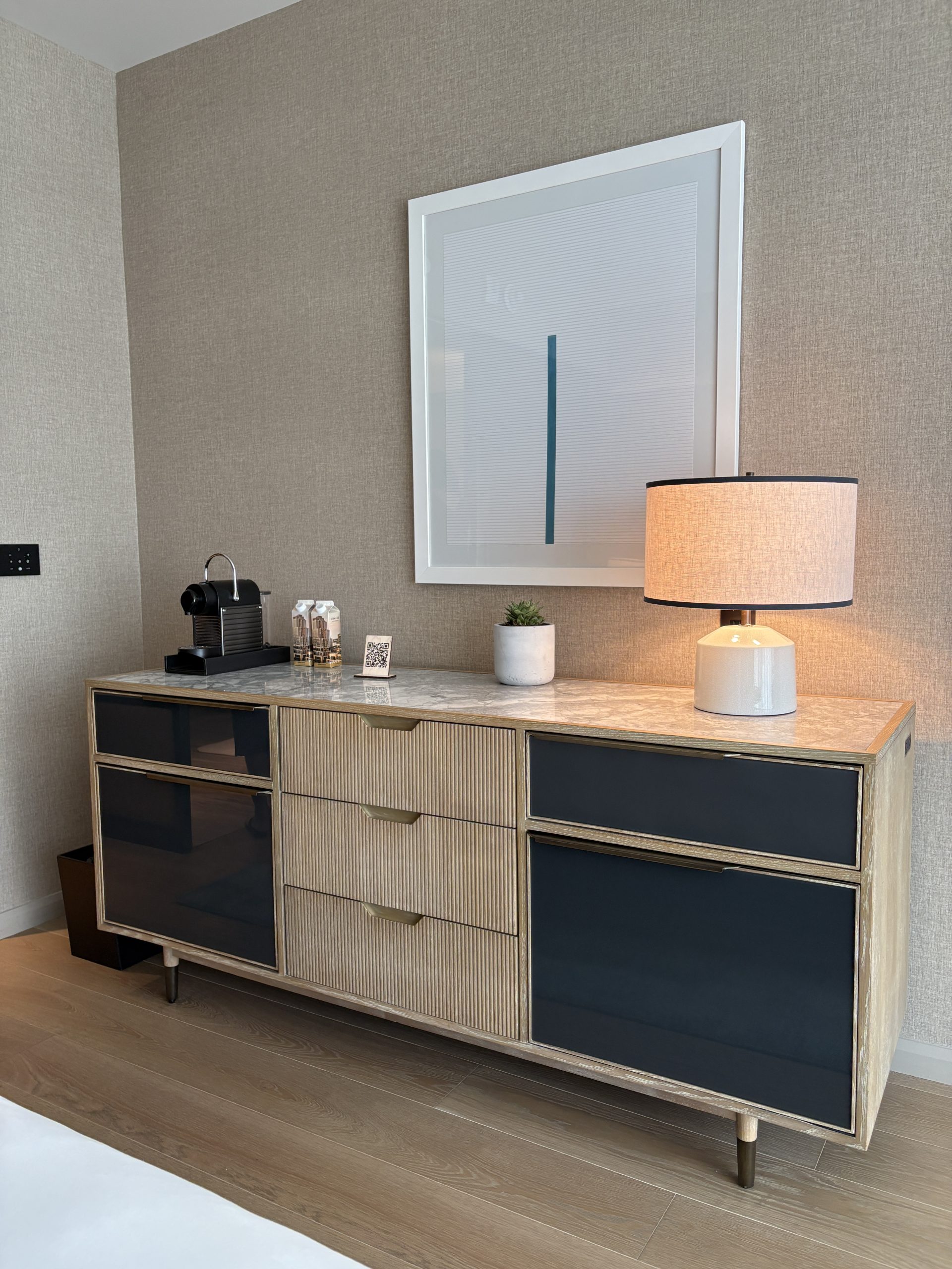 Marble top console with espresso station and mini bar
