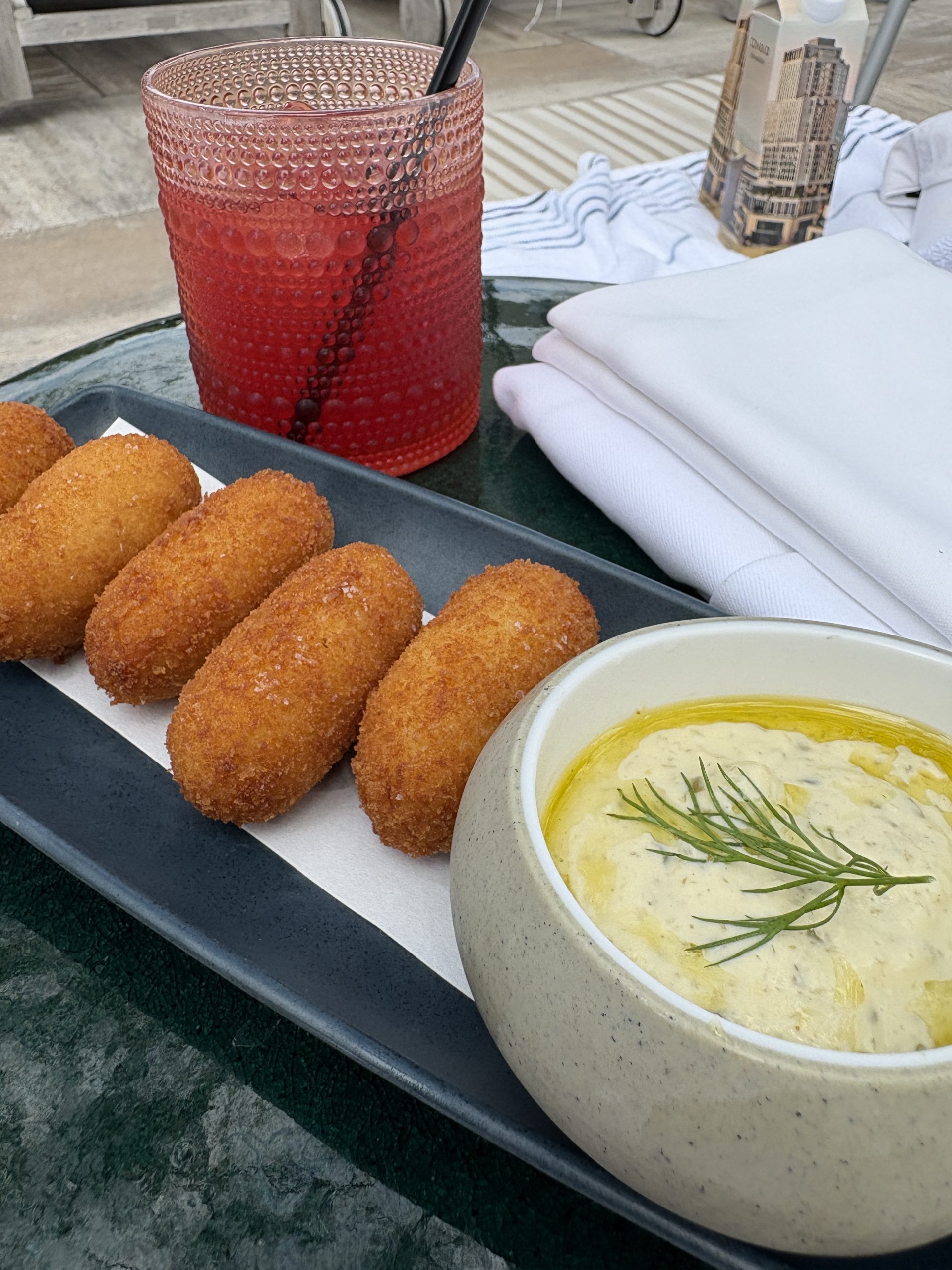 Croquettes & cocktail from the poolside bar