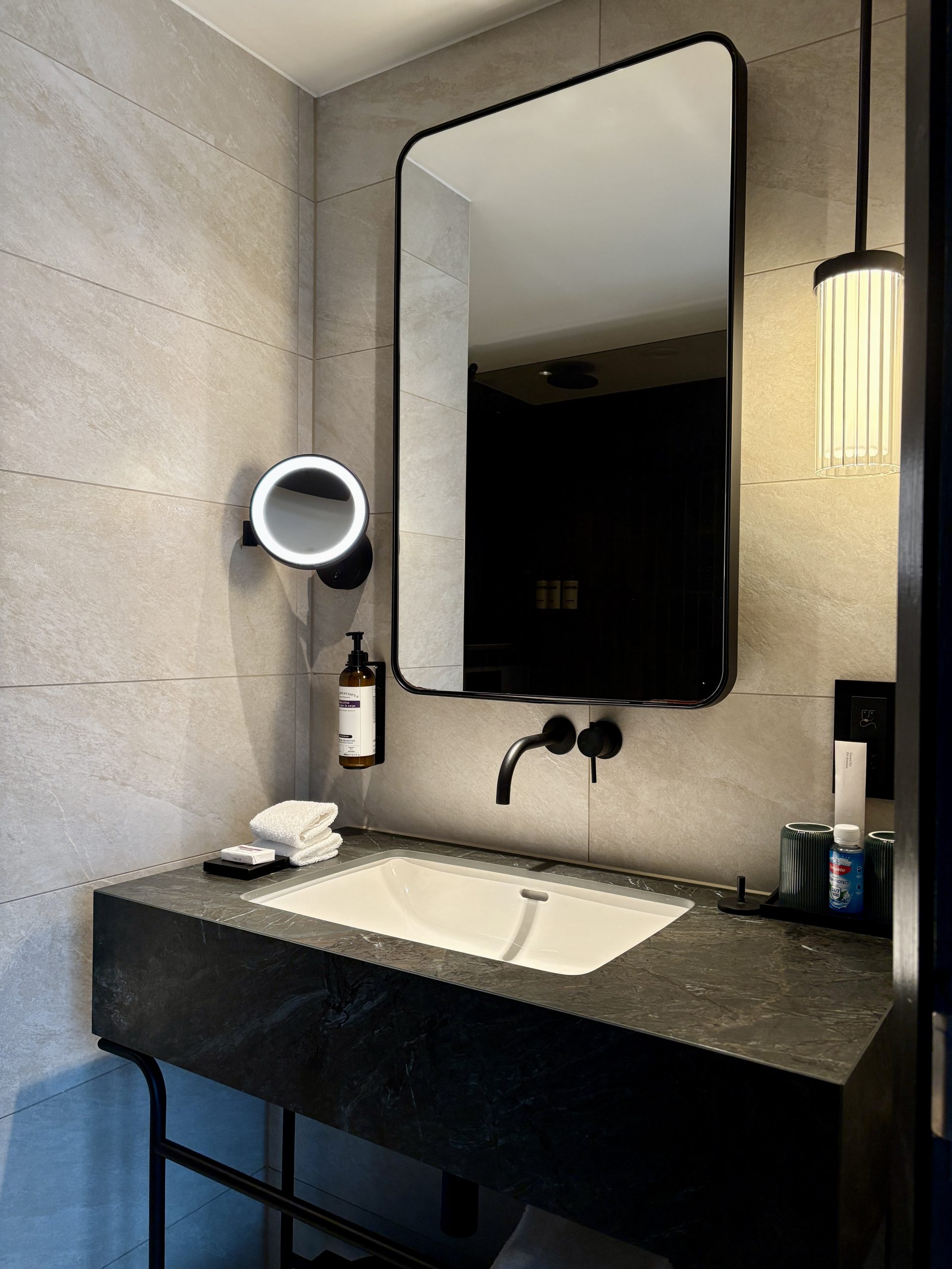 Large bathroom vanity with amenities