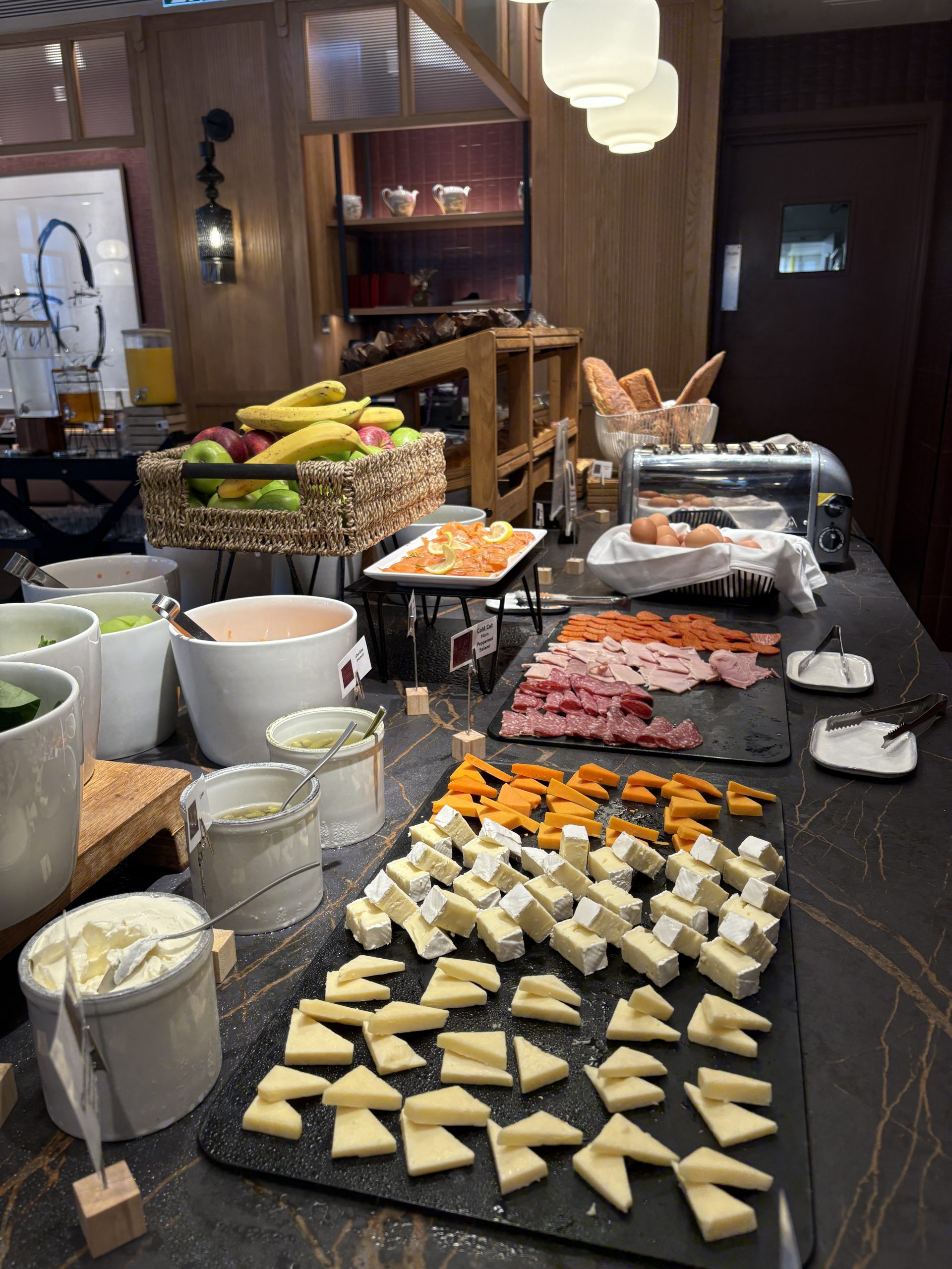 Cheese plates and fruits at breakfast