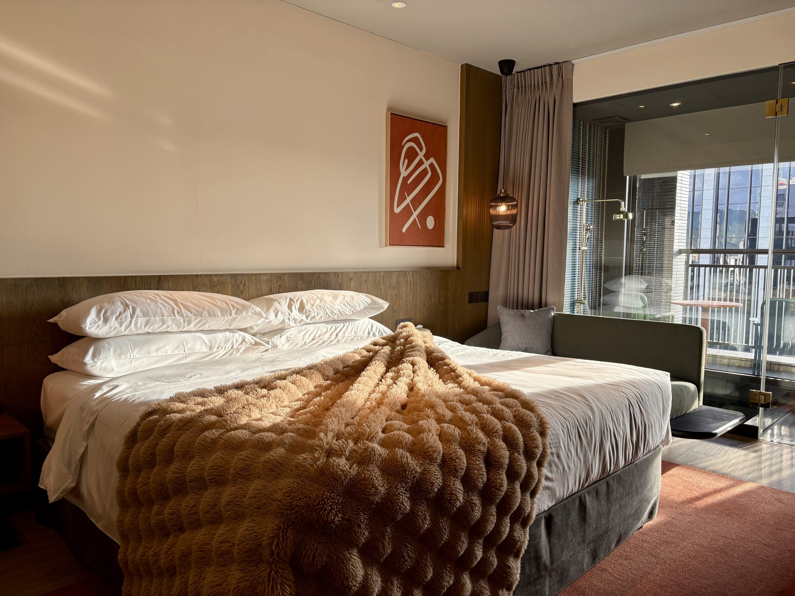 Cozy king bed with great lighting in the room