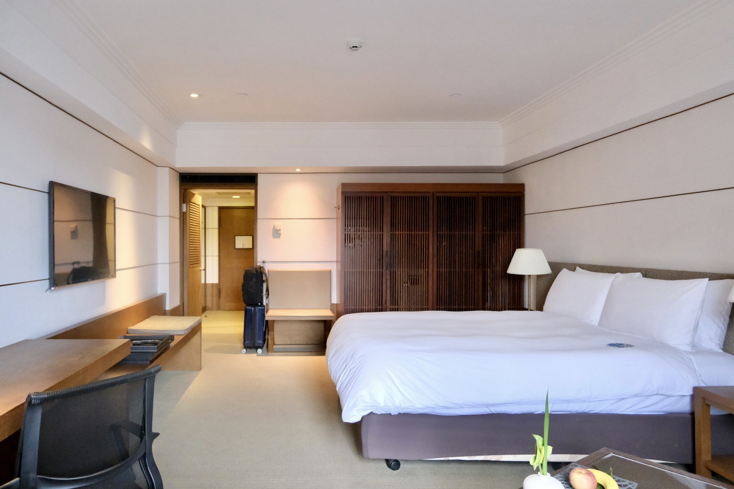 Spacious bedroom with ample storage space and work space
