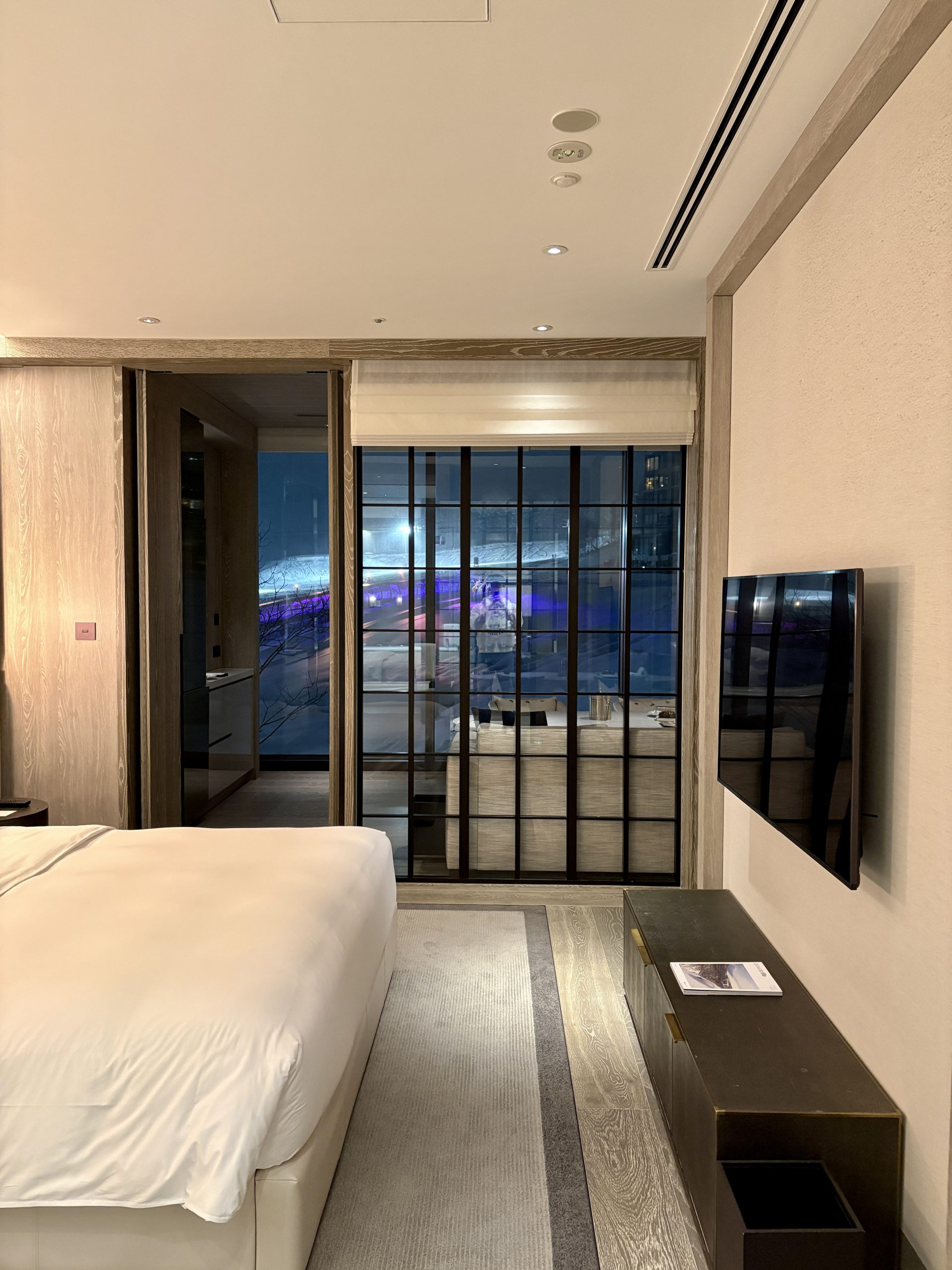Master bedroom with a view to the slope side through the dining room