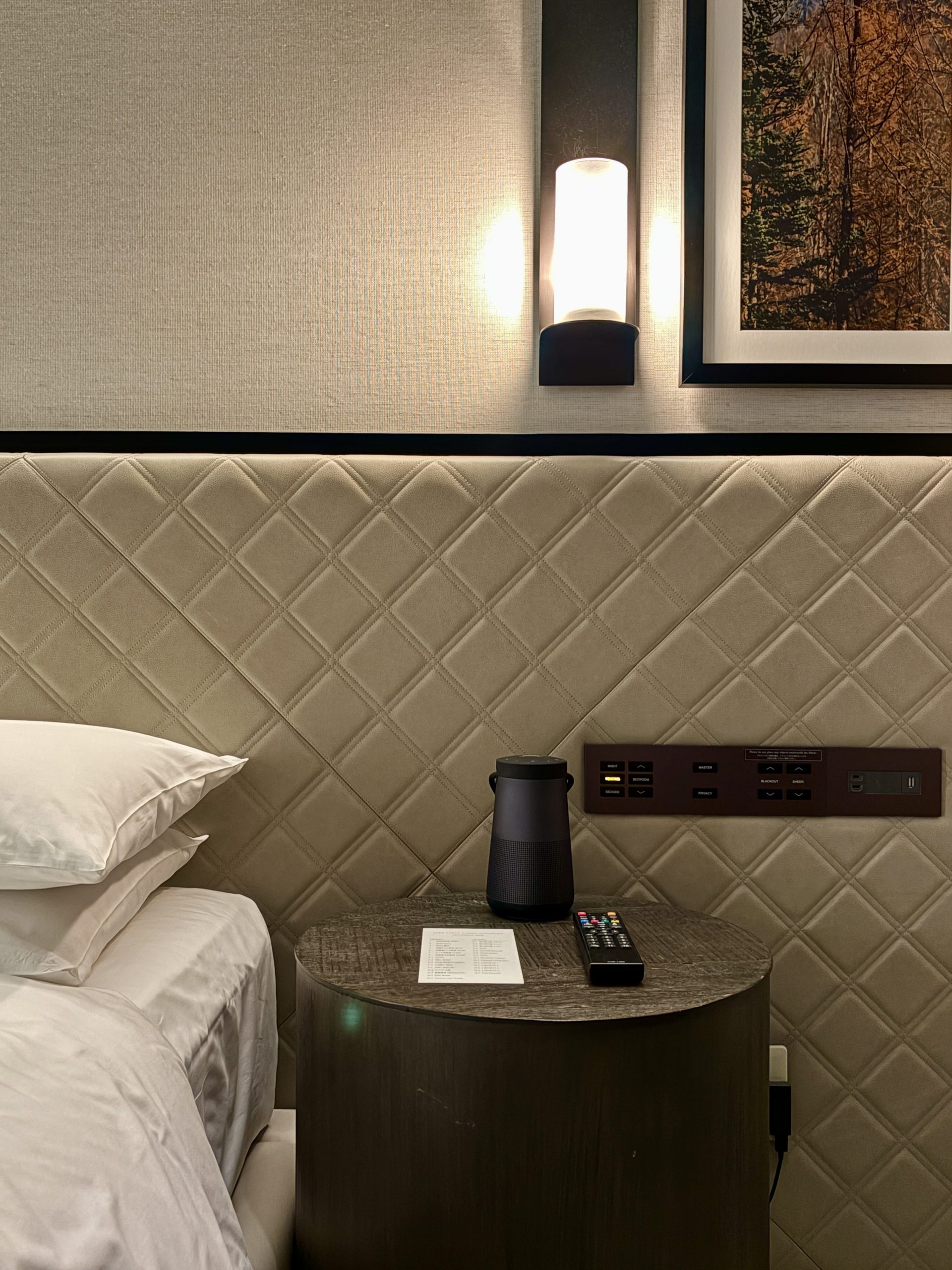 Portable bose speaker on the bedside table