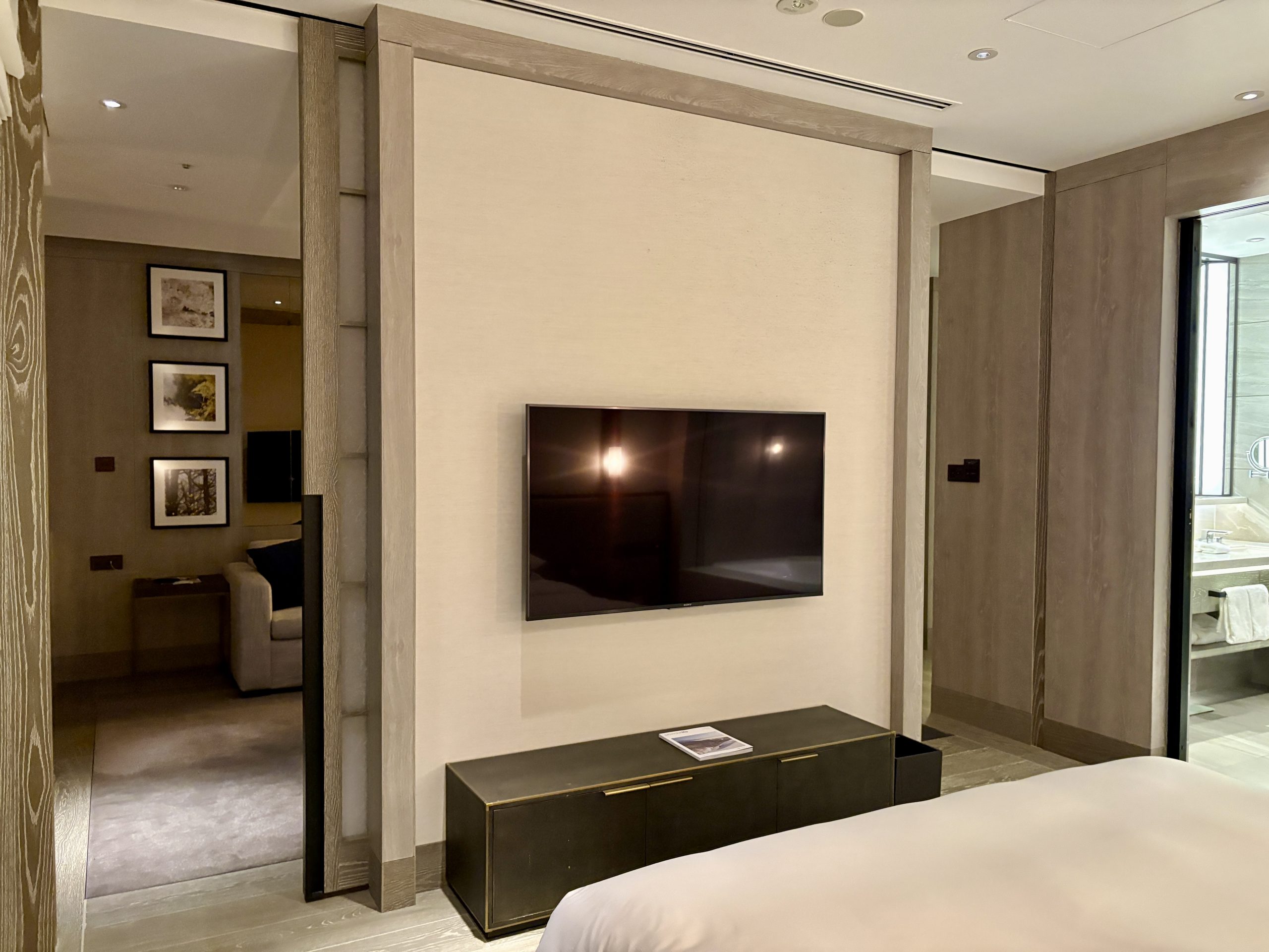 Sliding doors to the living room on each side of the master room TV