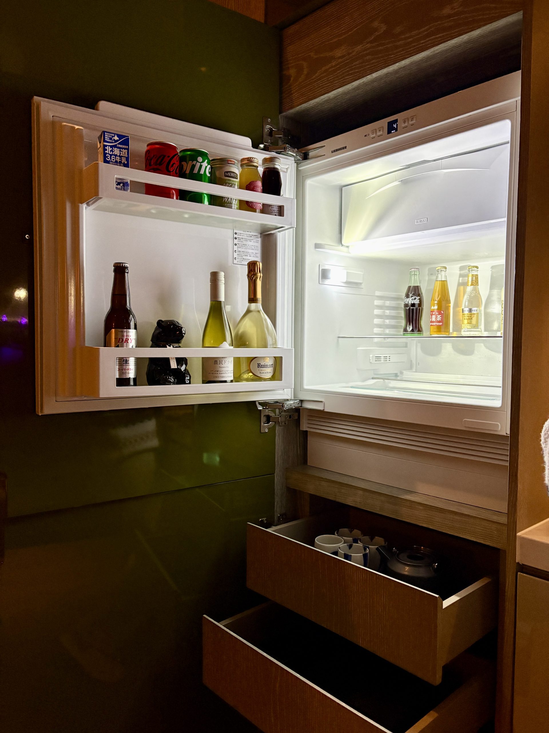 Fridge and tea set at the mini bar