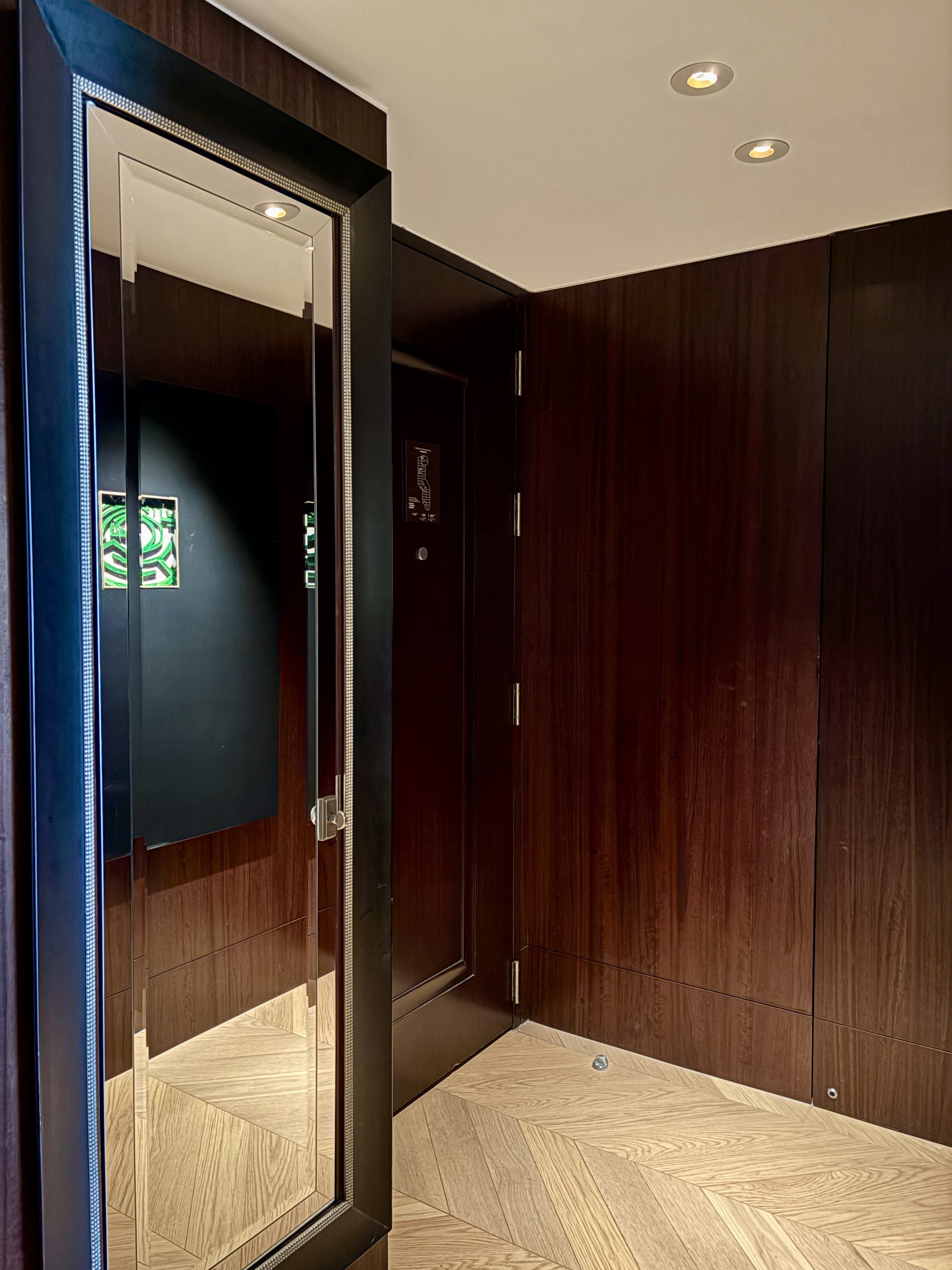 Foyer area with valet laundry closet