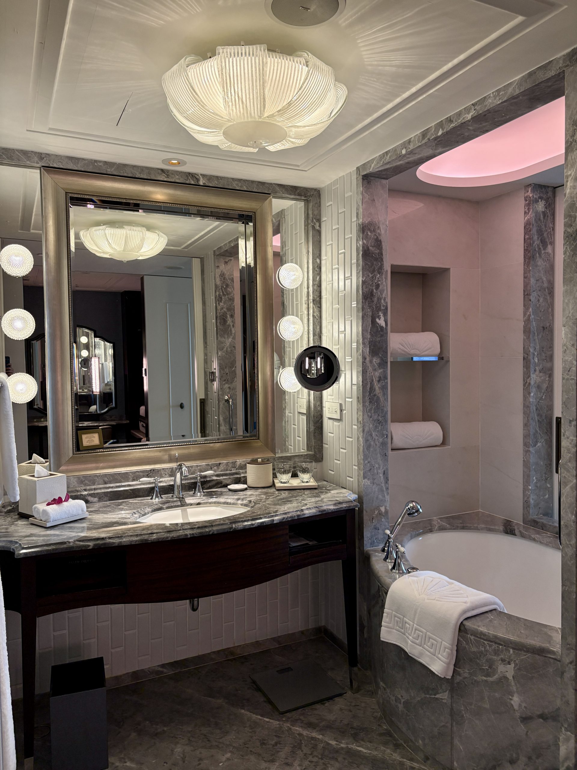 Luxurious bathroom with a nice bathtub and marble vanity