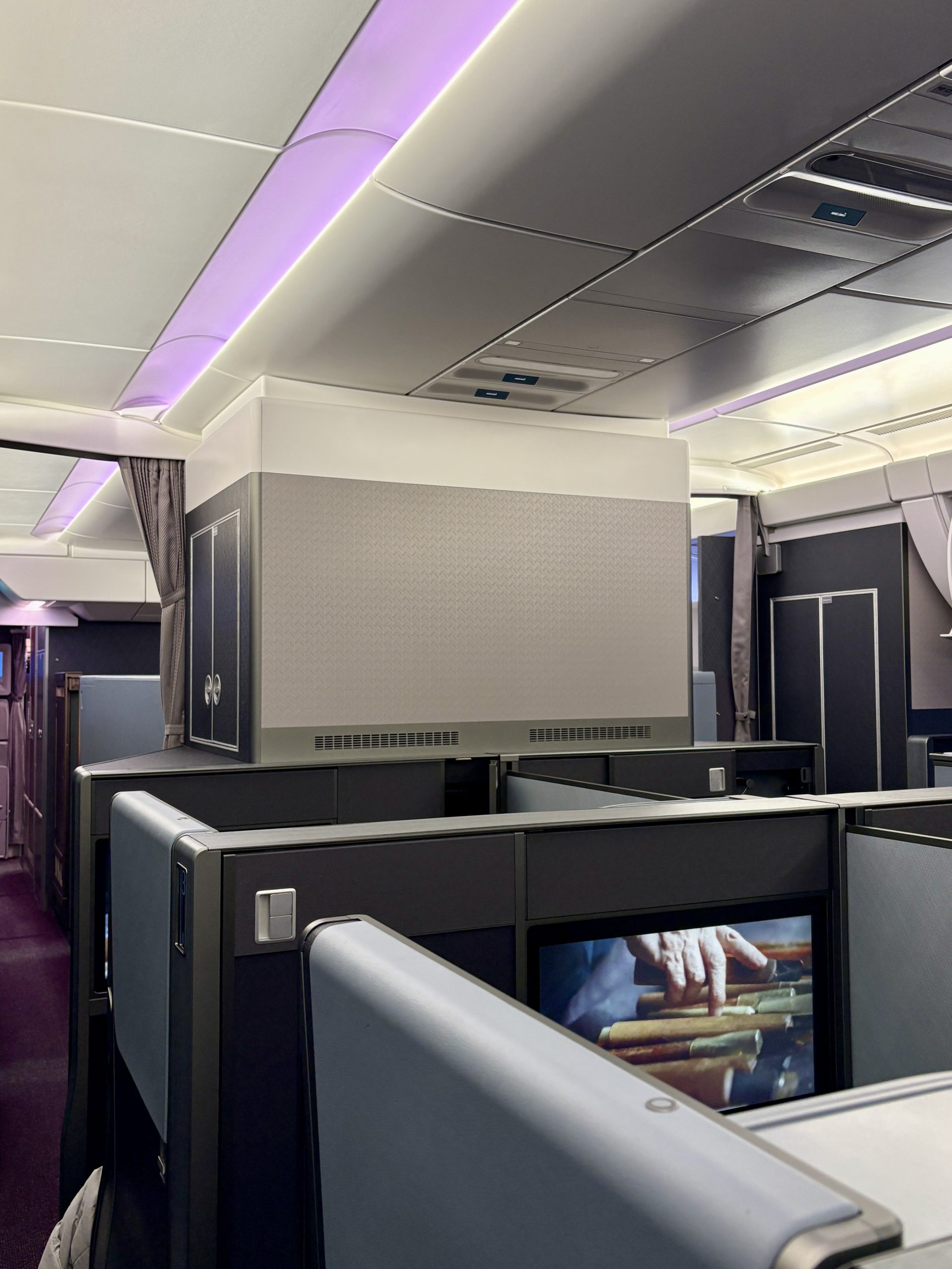 Clean, organized, and classy business class cabin