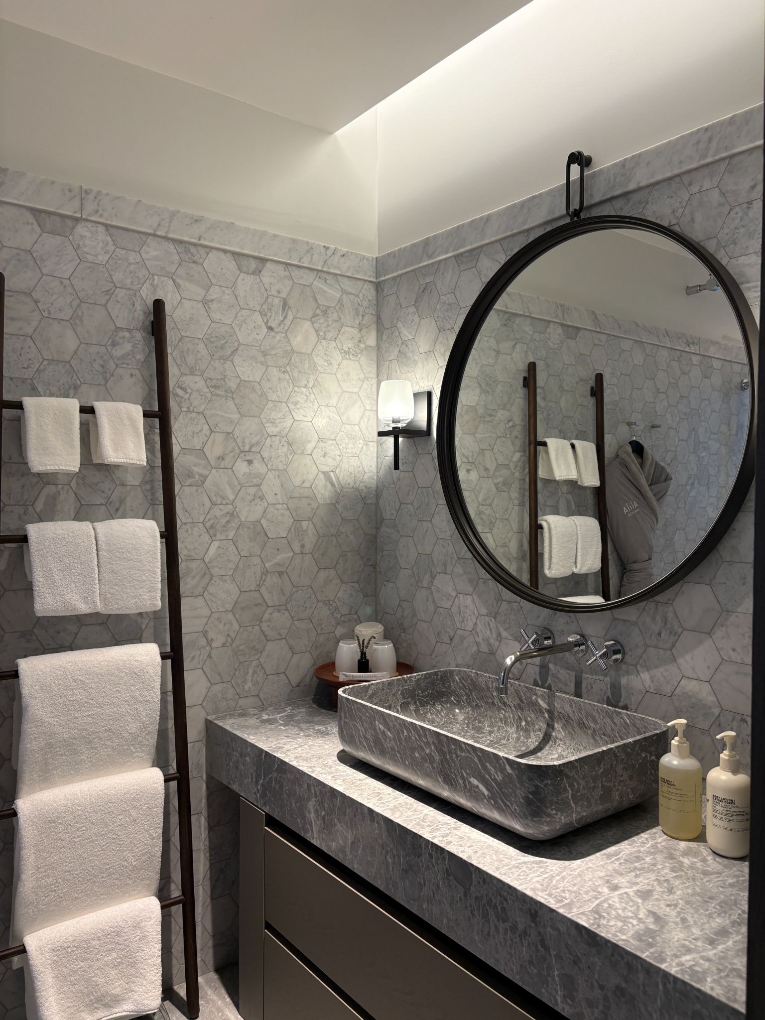 Luxurious marble counter with full bath amenities