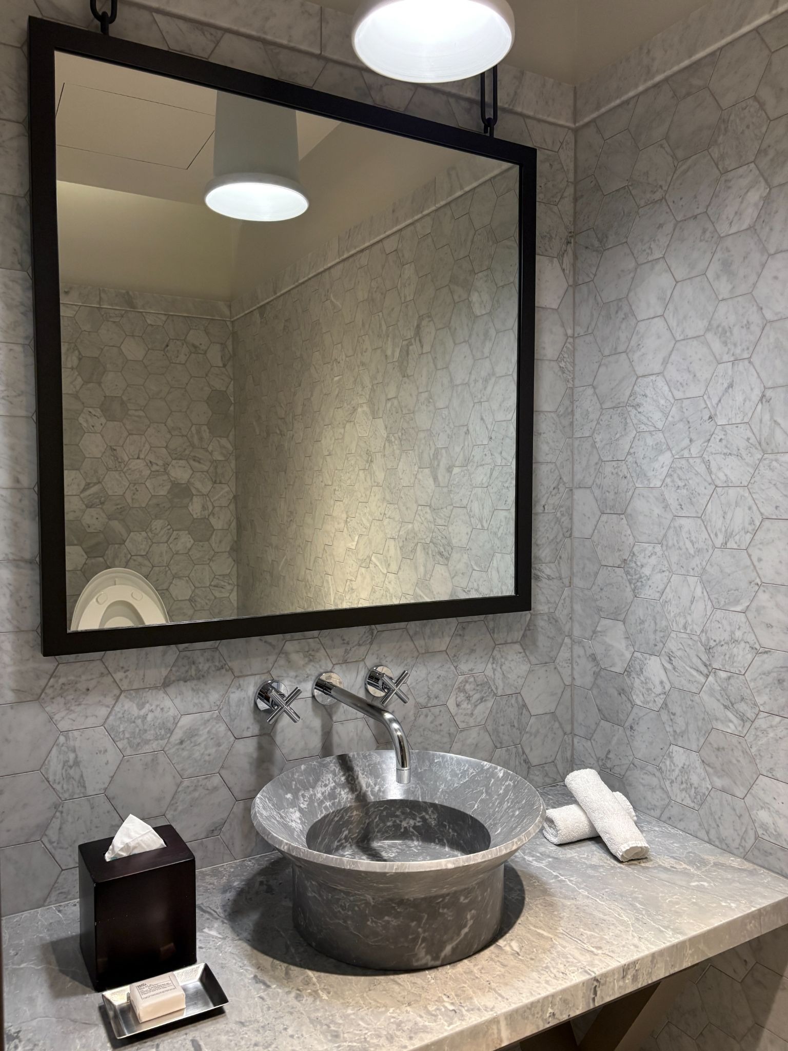 Washroom sink next to the room entrance
