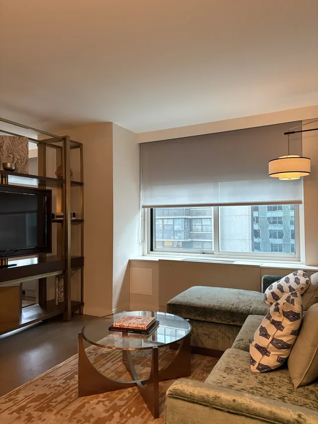 Comfortable sofa bed in the living space with a console table