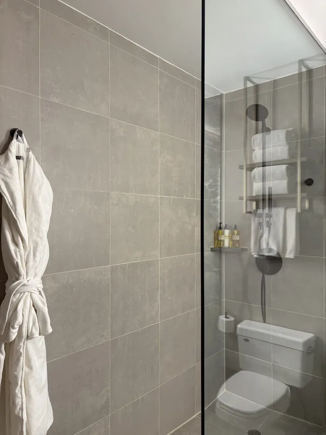 Walk in shower with glass wall