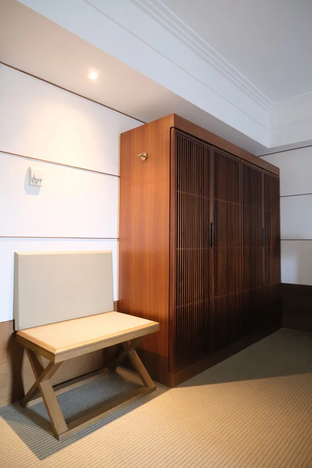 Large wooden closets and luggage rack