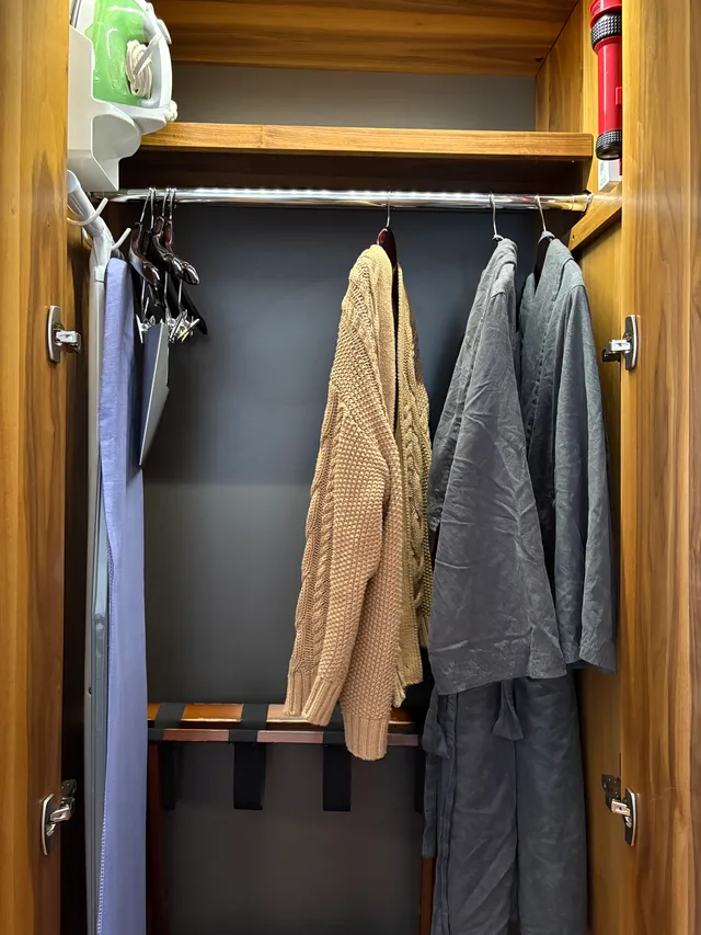 Inside the closet: bathrobes and iron board