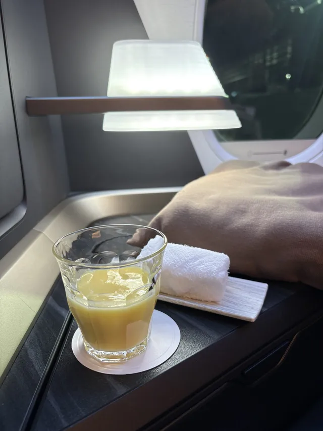 Pre-departure drink and hot towel