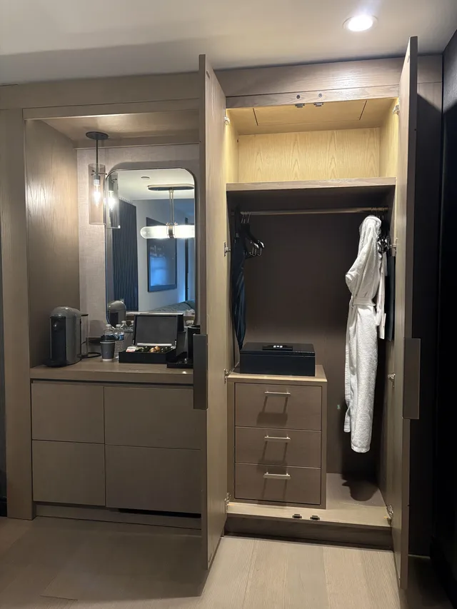 Closet space next to the mini bar console