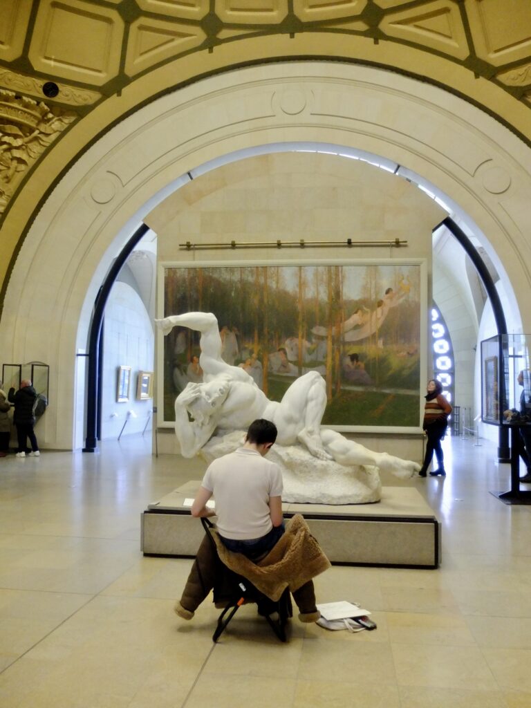 artist drawing a sculpture